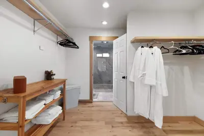 a bathroom with a closet with white towels at Hot TubSaunaPoolPrivate Beach Tahoe Oasis in Zephyr Cove