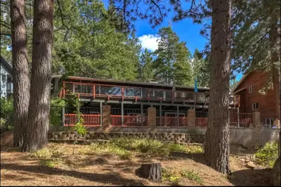 a house in the woods with trees at Hot TubSaunaPoolPrivate Beach Tahoe Oasis in Zephyr Cove