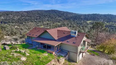 an aerial view of a house on a hill at Sierra Mountain View Retreat in Coarsegold