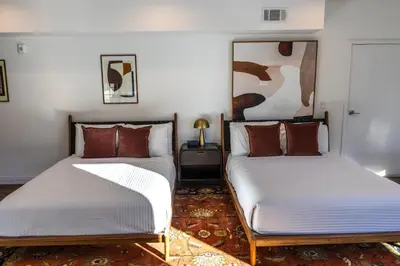 two beds sitting next to each other in a room at The Sierra House in Mammoth Lakes