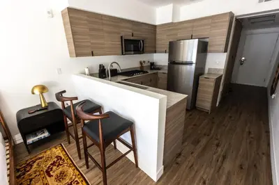 a kitchen with a counter and a refrigerator at The Sierra House in Mammoth Lakes