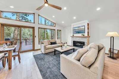 a living room with two couches and a fireplace at Tahoe City Retreat - Creekside Deck & Hot Tub in Tahoe City