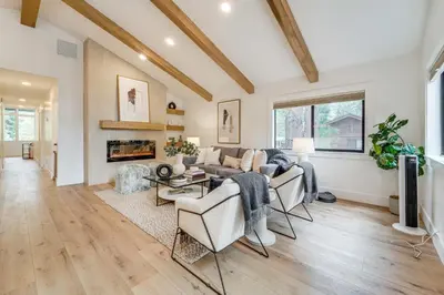 a living room with a couch and a table at Walk to Gondola Truckee Retreat with Resort Perks! in Truckee