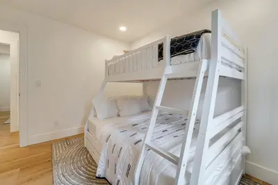 a bedroom with a bunk bed with a ladder at Walk to Gondola Truckee Retreat with Resort Perks! in Truckee
