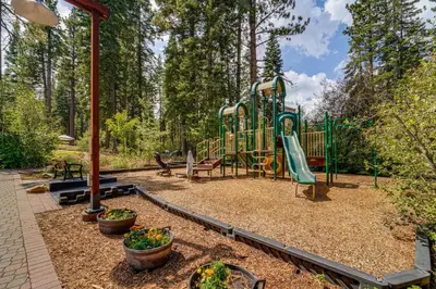 a park with a playground with a slide at Walk to Gondola Truckee Retreat with Resort Perks! in Truckee