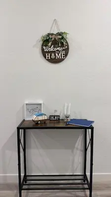 a desk with a sign that says wilderness has me at New Holiday Retreat in Merced in Merced