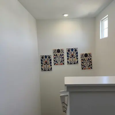 three pieces of art on the wall in a room at The Orchid house !! Your home away from home Gateway to Yosemite & UC Merced this for a Room in Merced