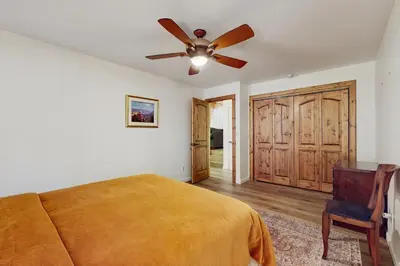 a bedroom with a bed and a ceiling fan at Tahoe Alpine and Lake Escape in Carnelian Bay