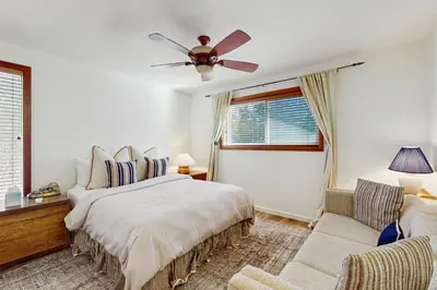 a bedroom with a bed and a couch at Tahoe Alpine and Lake Escape in Carnelian Bay
