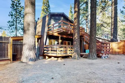 a house in the woods with trees at Charming Cabin in South Lake Tahoe