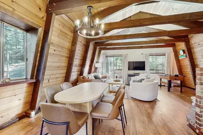 a dining room with a table and chairs at Charming Cabin in South Lake Tahoe