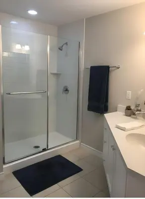 a bathroom with a glass shower and a sink at PINECREST MAMMOTH LAKES in Mammoth Lakes