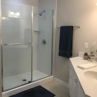 a bathroom with a shower with a glass door at PINECREST MAMMOTH LAKES in Mammoth Lakes