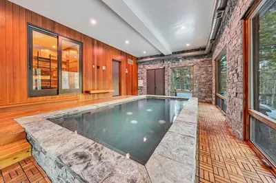 an indoor swimming pool in a house at South Lake Tahoe Escape - Private Hot Tub Pool in South Lake Tahoe