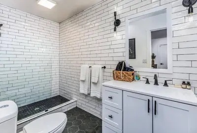 a white bathroom with a toilet and a sink at Peytons Luxury Suite at The Four Daughters Inn in Oakhurst