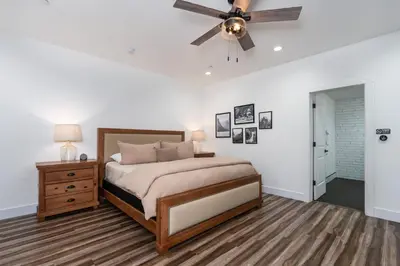 a bedroom with a bed and a ceiling fan at Ryann Suite at The Four Daughters Inn in Oakhurst