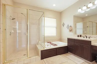 a bathroom with a shower and a sink at Oasis on the vine - Custom Luxury Resort Amenities in Lodi