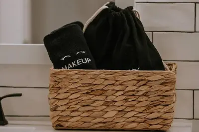 a basket with two towels in it on a counter at Kassidy Suite at The Four Daughters Inn in Oakhurst