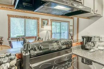 a kitchen with a stainless steel stove top oven at Little Ski Lodge-Across from Spa & Sauna in Shaver Lake
