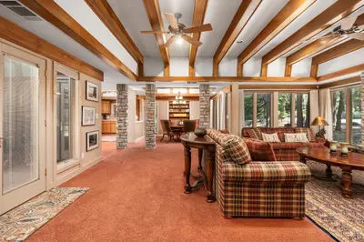 a living room with couches and a ceiling at Single level Family cabin-Fenced in yard for pets & kids in Shaver Lake