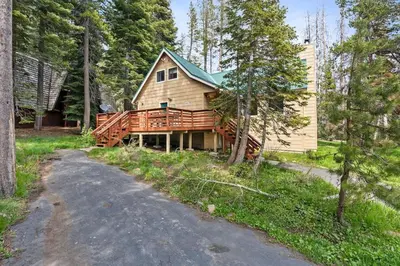 a house with a deck and a driveway at Black Diamond-Family Pet Friendly & Near China Peak in Big Creek