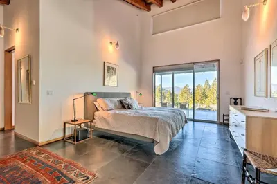 a bedroom with a bed and a large window at A Quiet Escape in Truckee