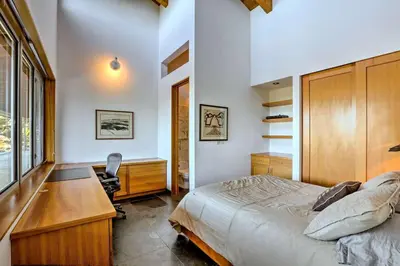 a bedroom with a bed and a desk and a desk at A Quiet Escape in Truckee