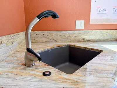 a kitchen sink with a faucet on a counter at Charming Lake Tahoe Getaway 30 Plus Days Bookings Only Accepted in Zephyr Cove