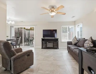 a living room with a couch and a flat screen tv at Casa Cortez C in Visalia