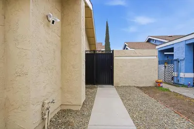 a building with a security camera on the side of it at Casa Cortez C in Visalia