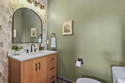 a bathroom with a sink and a mirror at Evergreen Getaway Pet Friendly in SLT w Hot Tub in South Lake Tahoe
