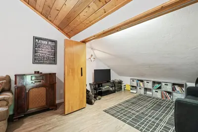 a living room with a couch and a tv at Apple Blossom Lodge-Family Friendly Cabin in Shaver Lake