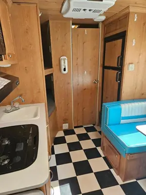 a kitchen with a sink and a checkered floor at Gold Rush Historical Resort in Sonora