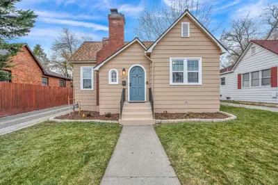 a house with a blue door in a yard at New-Near Midtown-HotTub-Firepit-Arlington Manor in Reno