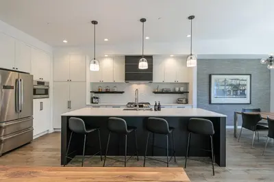 a kitchen with a large island in the middle at Starfall Run at Palisades by Tahoe Getaways - Luxury 3BR w Ski Shuttle, A/C & Bonus Room! in Alpine Meadows