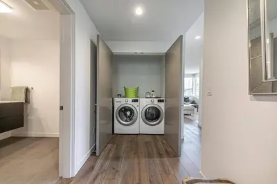 a laundry room with a washer and dryer in it at Starfall Run at Palisades by Tahoe Getaways - Luxury 3BR w Ski Shuttle, A/C & Bonus Room! in Alpine Meadows