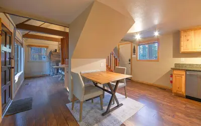 a kitchen and dining room with a table and chairs at The Heavenly Foothills For 4 in South Lake Tahoe