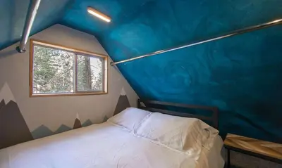 a bedroom with a blue ceiling with a bed in it at The Heavenly Foothills For 4 in South Lake Tahoe