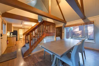 a dining room with a wooden table and chairs at The Heavenly Foothills For 4 in South Lake Tahoe