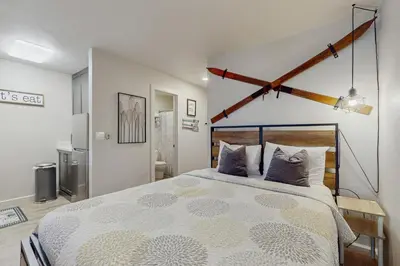 a bedroom with a large bed in a room at Cozy Kings Run Condo in Tahoe Vista