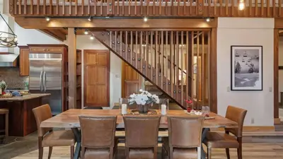a dining room with a wooden table and chairs at Near Ski Resorts Downtown Truckee Donner Lake Basque Lodge by AvantStay in Truckee