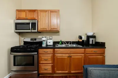 a kitchen with a stove and a microwave at Luxe Cozy 1 bedroom 1 bathroom near downtown in Sacramento