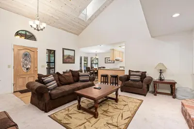 a living room with a couch and a table at Silverpine Chalet with Gym Family Friendly in Shaver Lake