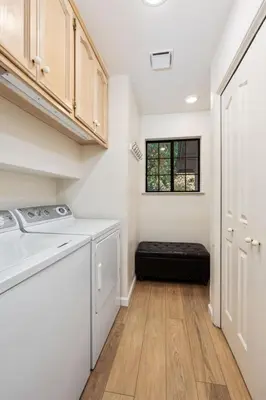 a kitchen with a washer and dryer and a window at Silverpine Chalet with Gym Family Friendly in Shaver Lake
