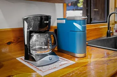 a blender sitting on a counter next to a trash can at Nana & Papas-Family Friendly in East Village in Shaver Lake