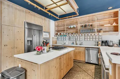 a kitchen with wooden cabinets and a counter top at Northstar Fairway Hot Tub Retreat in Truckee
