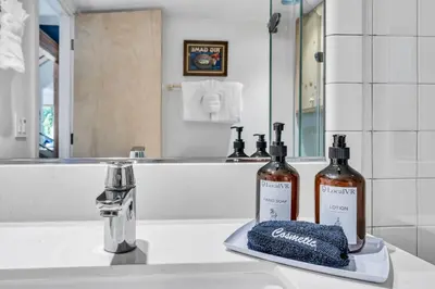 two bottles of wine sitting on a bathroom sink at Northstar Fairway Hot Tub Retreat in Truckee