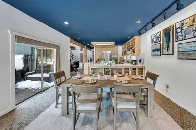 a kitchen and dining room with a table and chairs at Northstar Fairway Hot Tub Retreat in Truckee