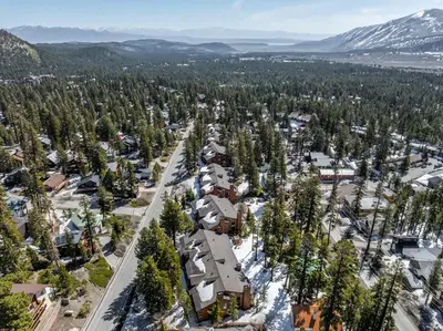 an aerial view of a town with trees and mountains at Mountainback 117 in Mammoth Lakes
