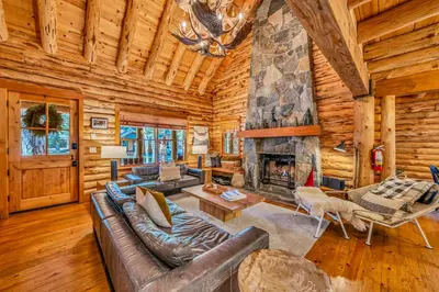 a living room with a couch and a fireplace at Lake Tahoe Haven Private Hot Tub Deck in Tahoma